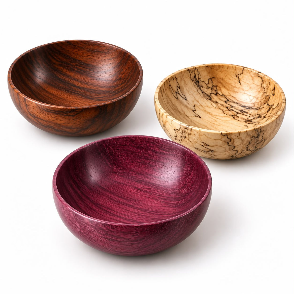Three wooden salad bowls with different wood grain patterns, shown on a clean white background.