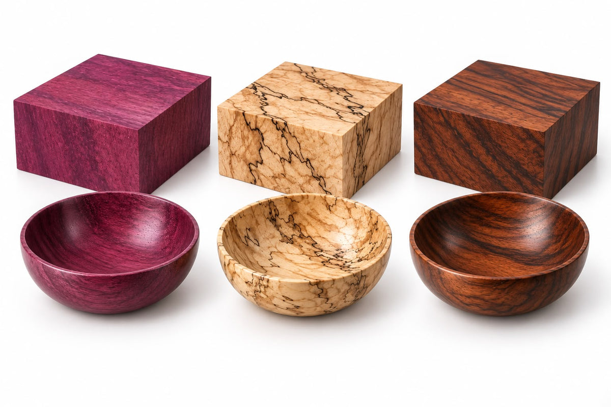 Three 6x6x2 inch kiln-dried exotic wood bowl blanks arranged with wood curls and green leaves, highlighting the deep purple tone of Purpleheart, ink-like lines of Spalted Tamarind, and rich reddish-brown grain of Granadillo.