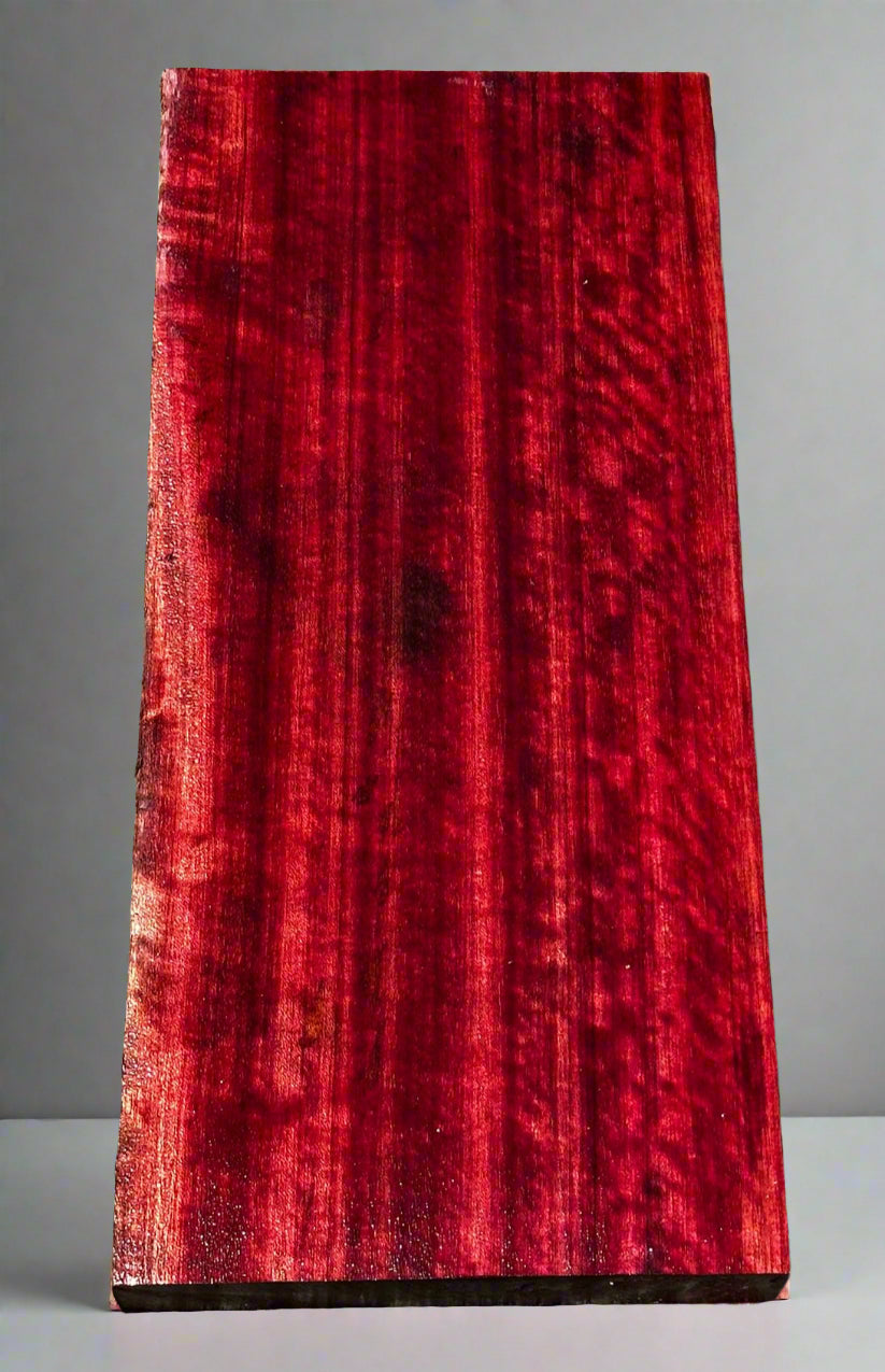 Red wooden slab on a gray surface
