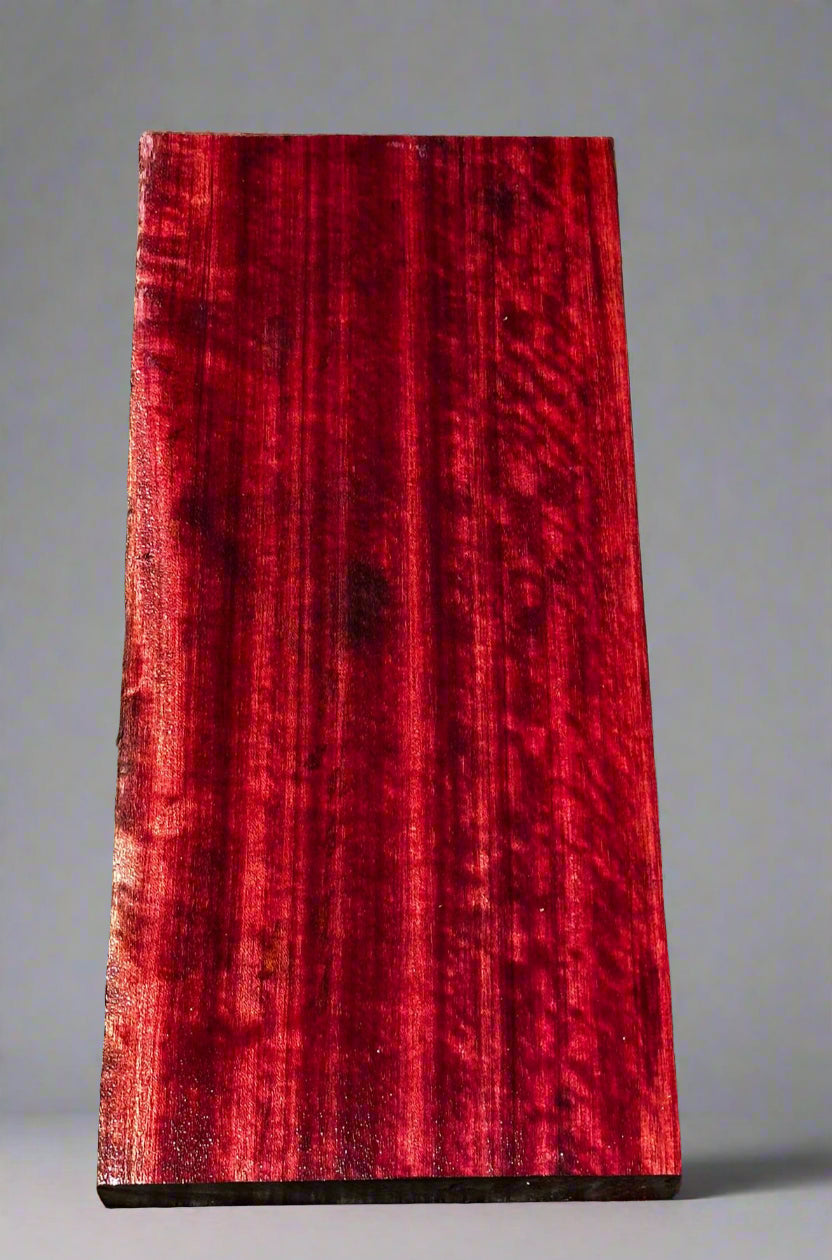 Red wooden slab on a gray surface