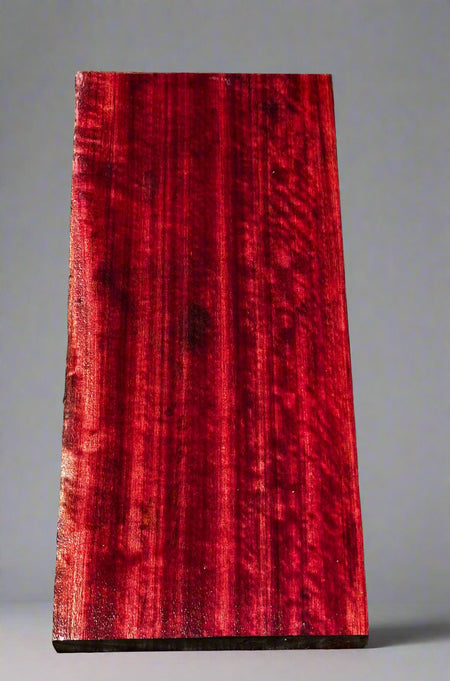 Red wooden slab on a gray surface
